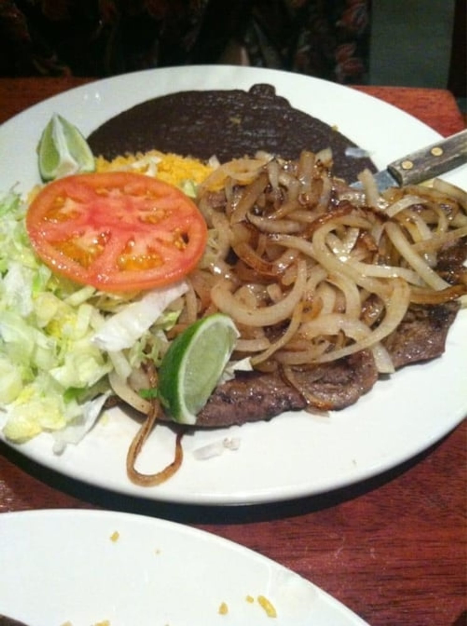 P8. Bistec Encebollado