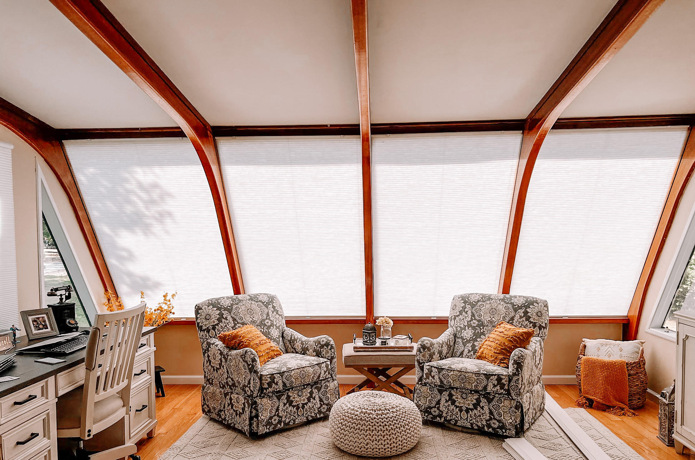 These custom Norman honeycomb shades are just right for this sunroom with beautiful arched windows in Morganville, NJ