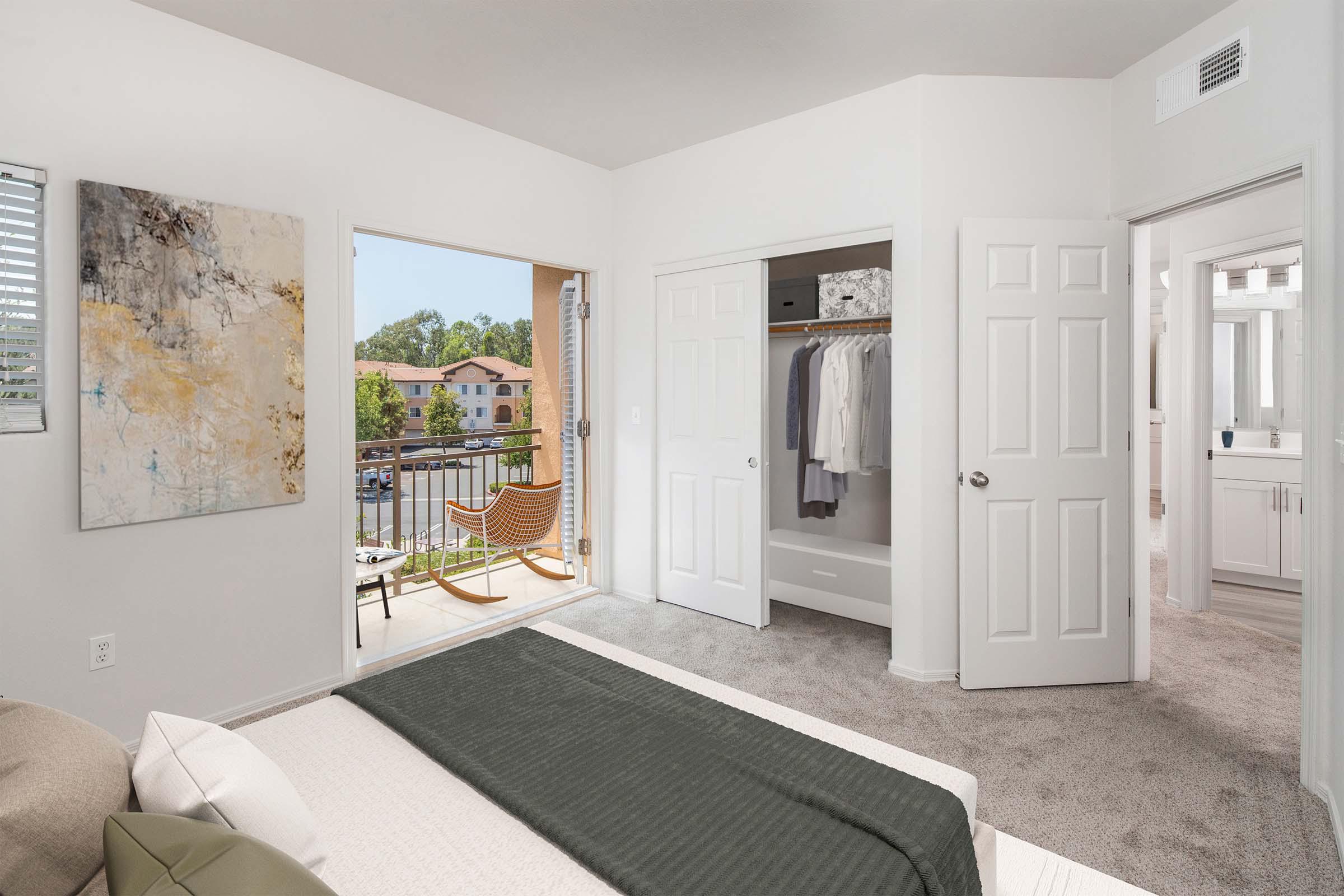 Townhome bedroom with spacious closet and private patio