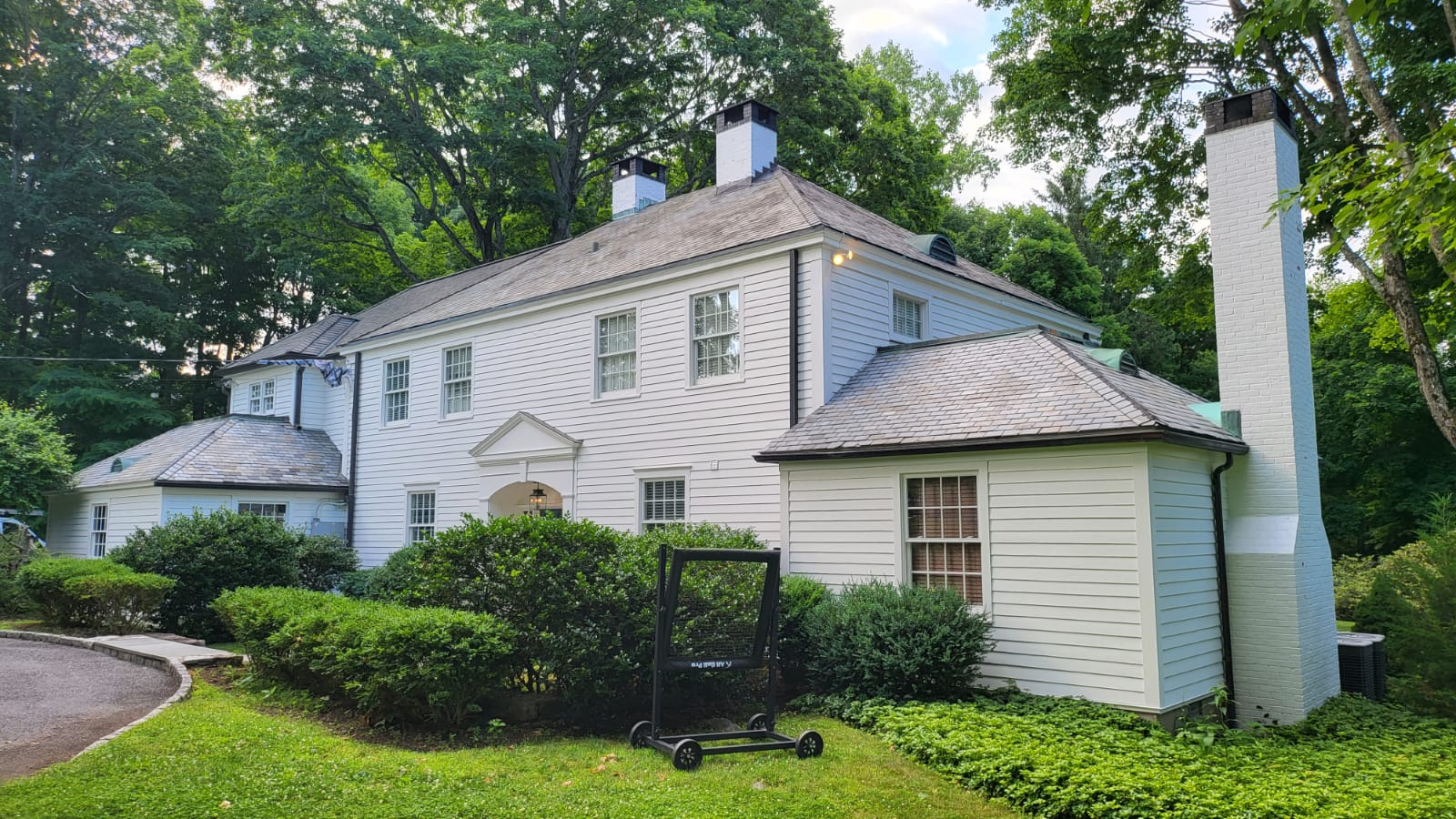 Cedar Siding and Extensive rot repair with copper gutters and yankee gutter delete in New Canaan