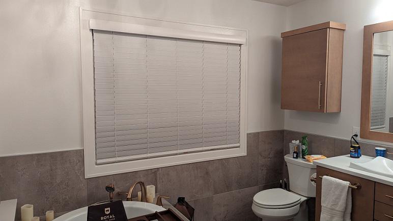 This bathroom has an amazing high-end feeling. Why skimp on the windows? These Cedar Falls homeowners added our Faux Wood Blinds to keep everything looking upscale!  BudgetBlindsCedarFallsWaterloo  CedarFallsIA  FauxWoodBlinds  MoistureResistantBlinds  FreeConsultation  WindowWednesday