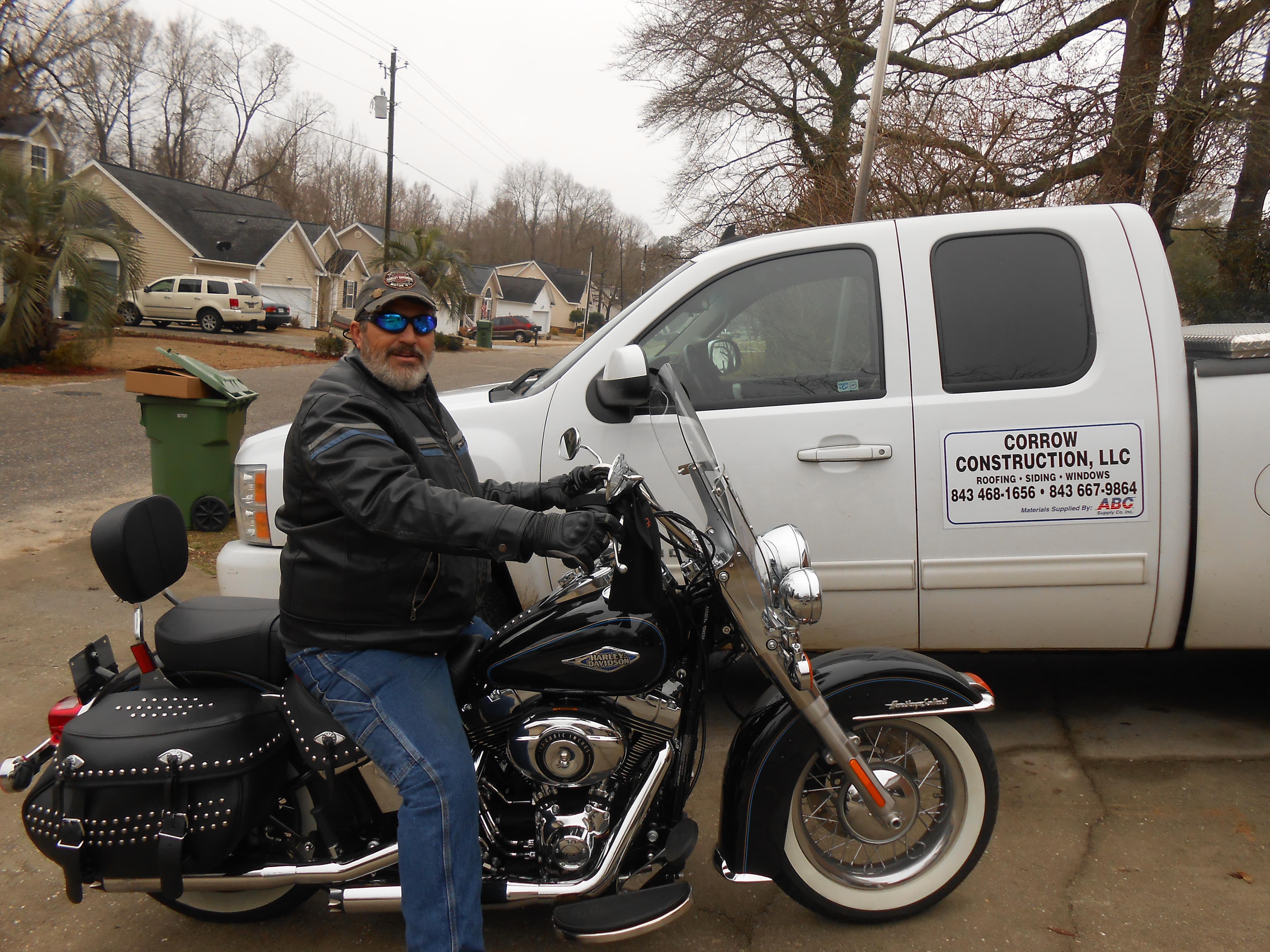 David on his bike, by his  work truck