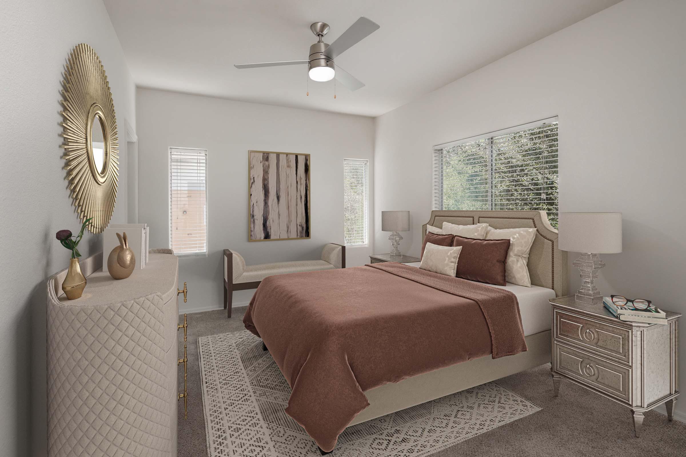 Bedroom with ceiling fan and windows