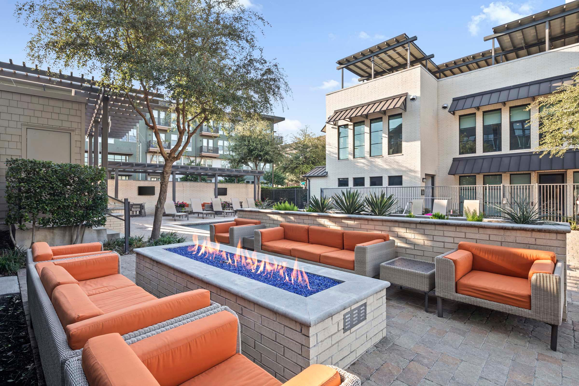 Villas side poolside firepit with seating at Camden Greenville