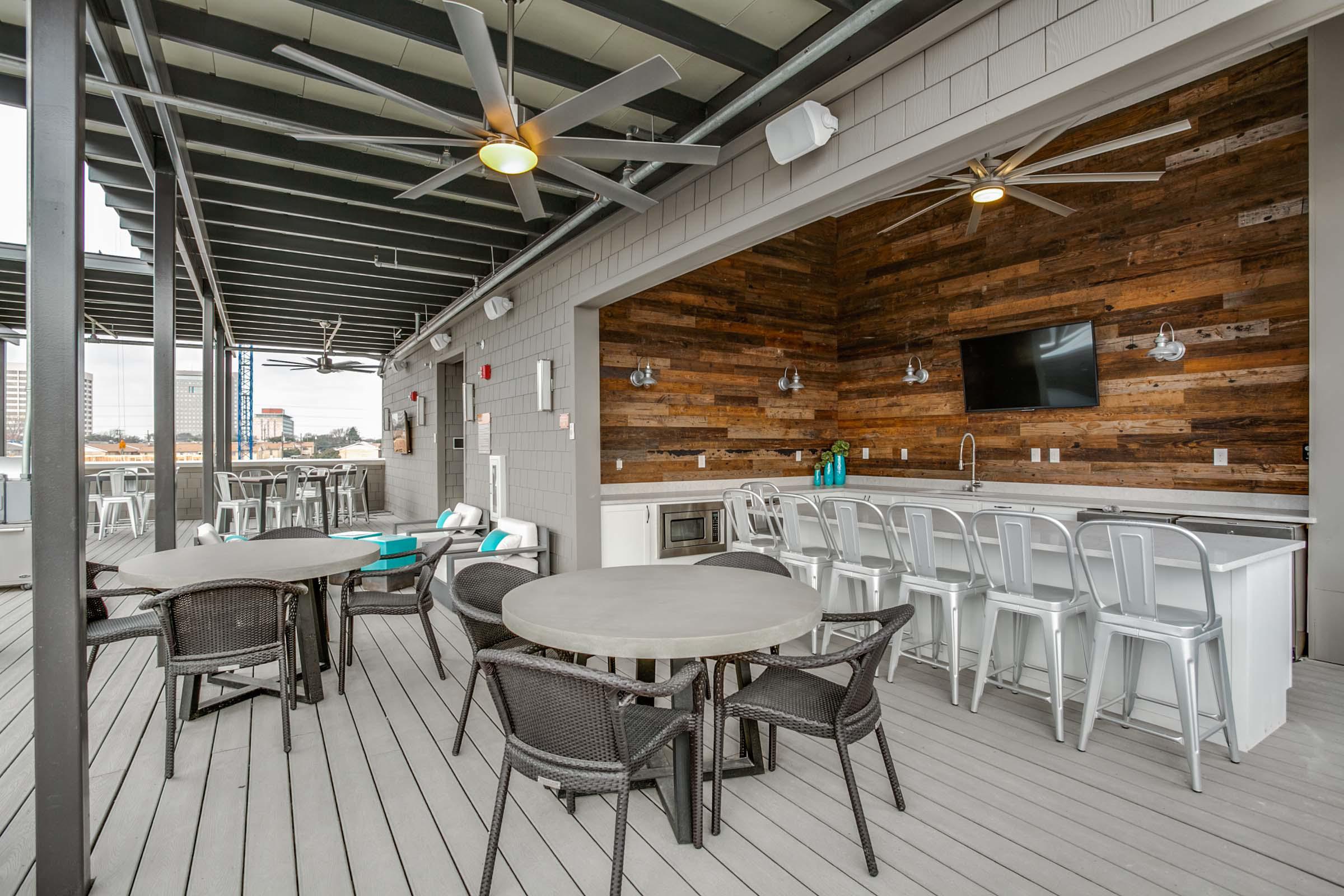 Villas side rooftop lounge with covered kitchen and bar area