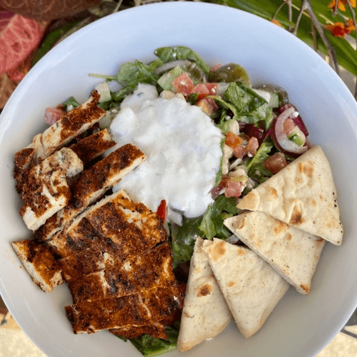 Salted. Greek Salad pictured with blackened chicken