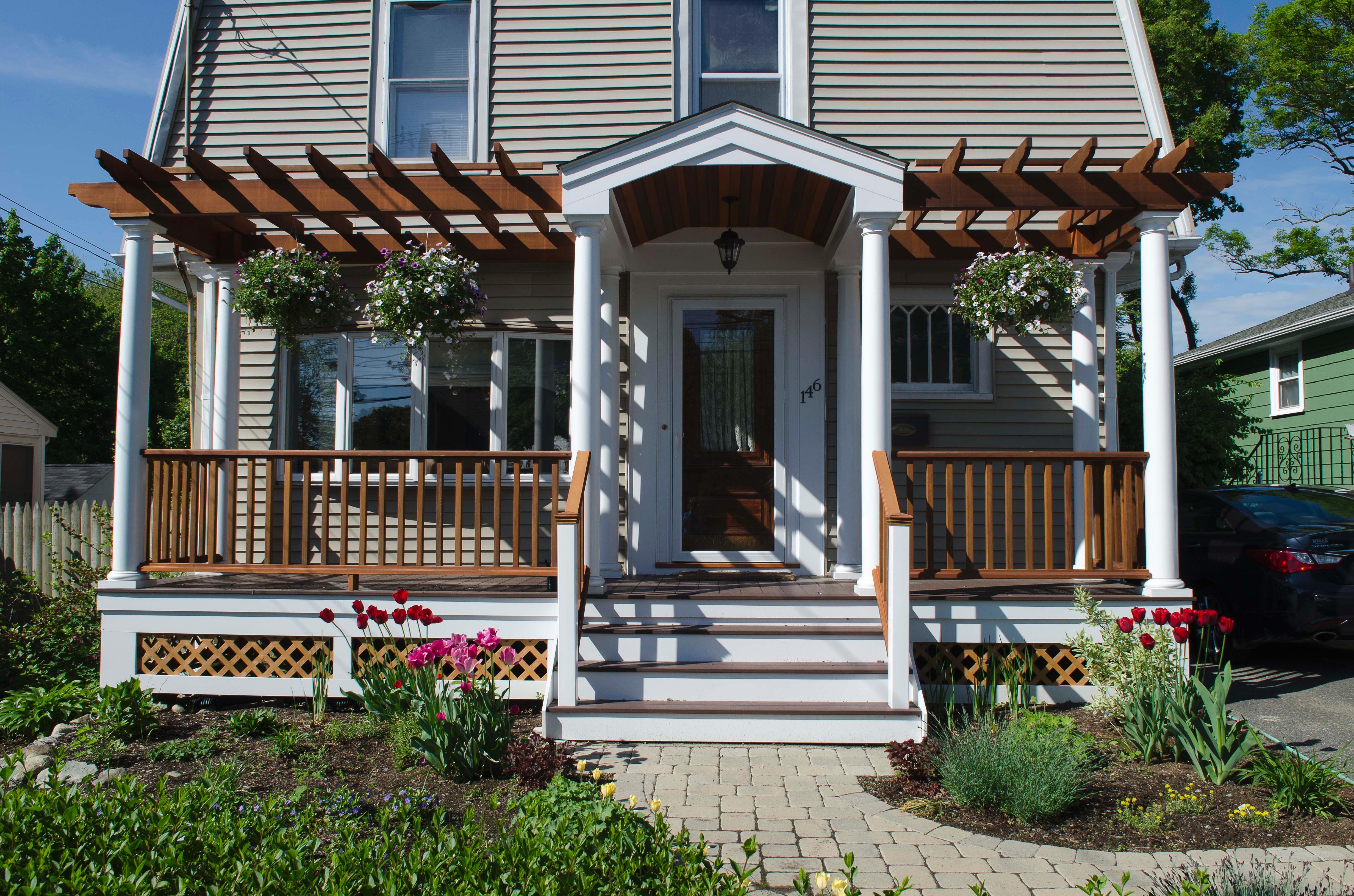 The porch, landscaping, and revised front walk create an appealing welcome.  