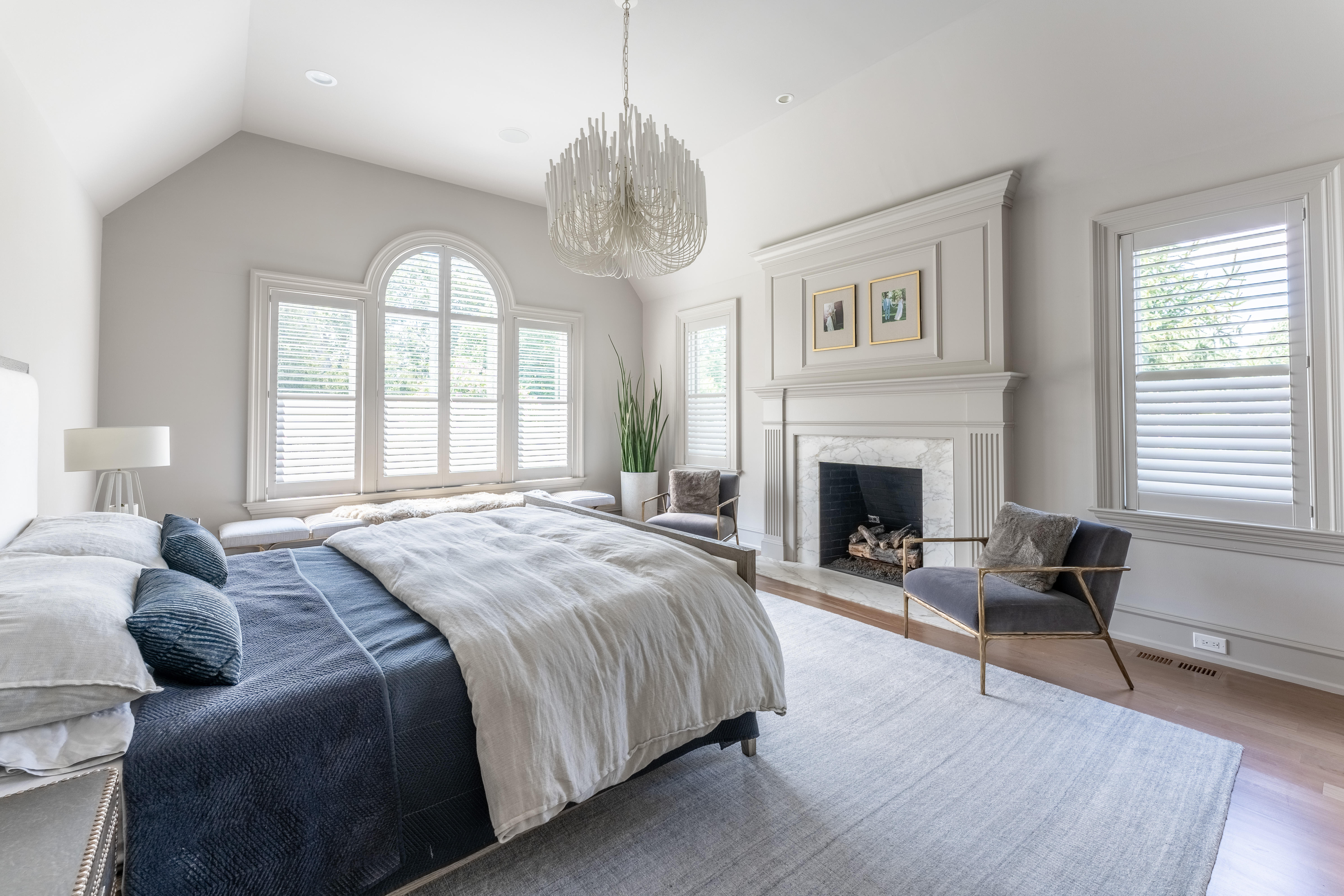 We love this clean and serene bedroom and there's no better way to finish the look than with our wood shutters. They can be customized to fit any unique window shape and are completely timeless! Call today for your free in-home consultation to install custom shutters in your home.