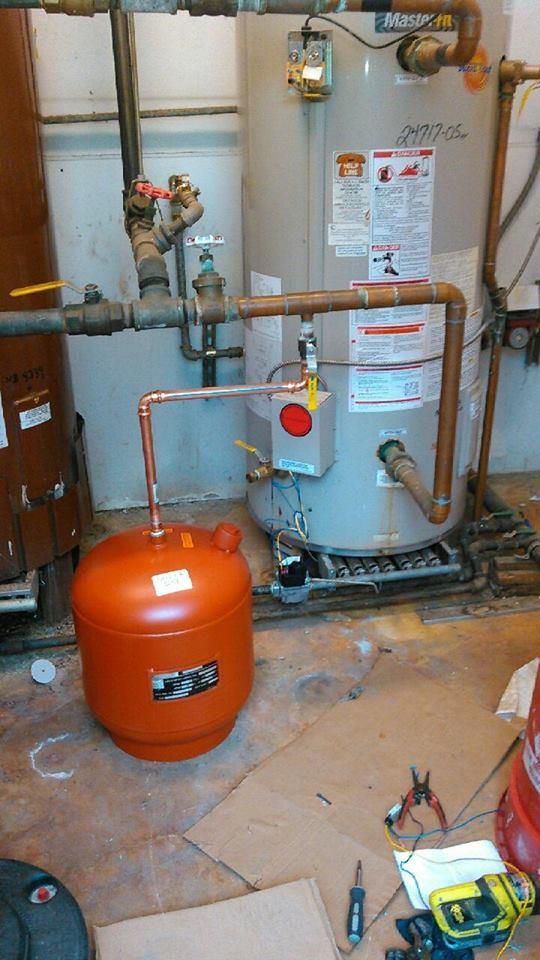 Recent installation of a new expansion tank (that orange thing that looks like a propane tank) for a commercial client. Why install one? To meet State of Washington code and for safety reasons.