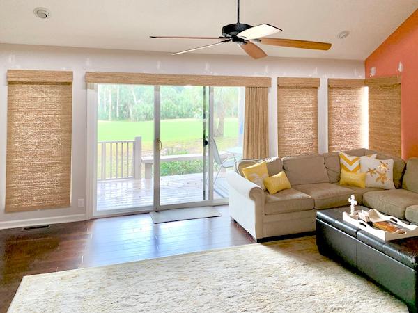 There's no better way to add a cozy feel to your living room than adding in some gorgeous woven wood shades! We love how these exotic shades compliment the dark wood flooring in this gorgeous Hilton Head living room.