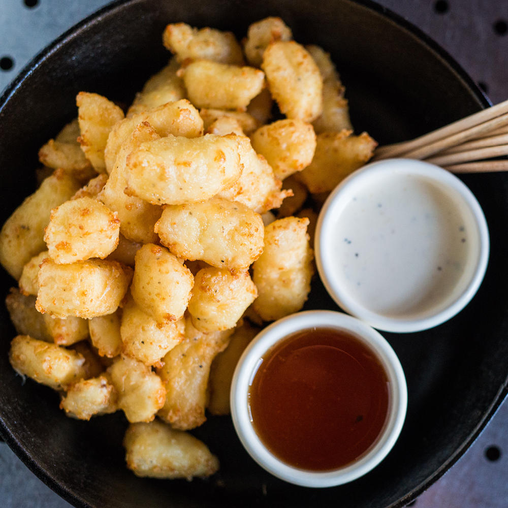 Don't be shy and give the Wisconsin Fried Cheese Curds a try.