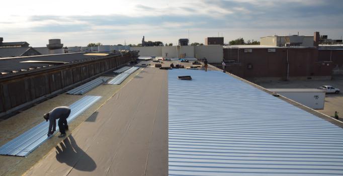 Here we see the second course of Metal panels being prepped for install. The second course will overlap the first and rest atop a high-temp synthetic underlayment.