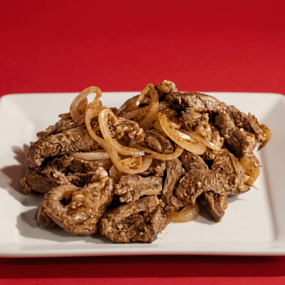Bisteck Encebollado