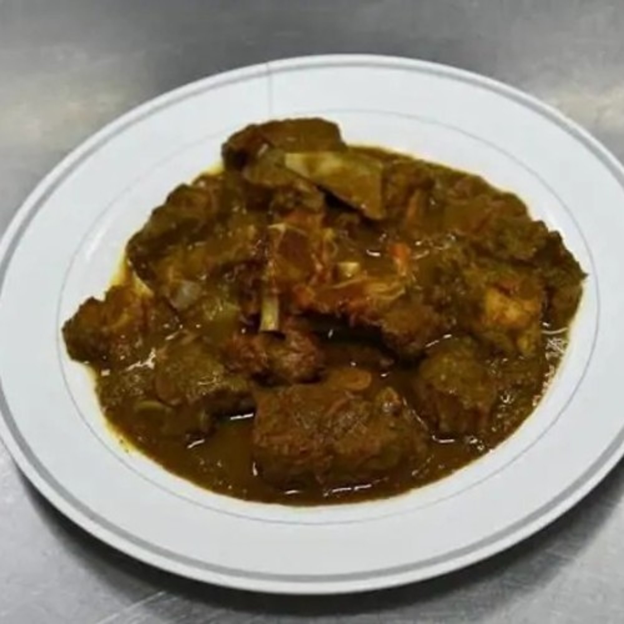 Curry Goat Rasta Paata Cabbage and Plantains
