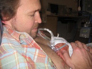Matthew Kovac holds tiny son Michael in the Alta Bates Summit NICU