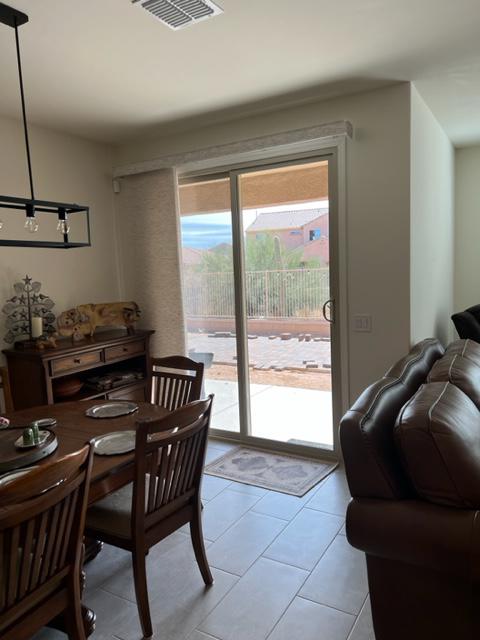 Recently installed Panel Track over a Dining Room Slider in Sahuarita, Arizona.  This panel track consists of 4 panels with a light filtering fabric.  There are are wide range of colors and textures available, including blackout material.