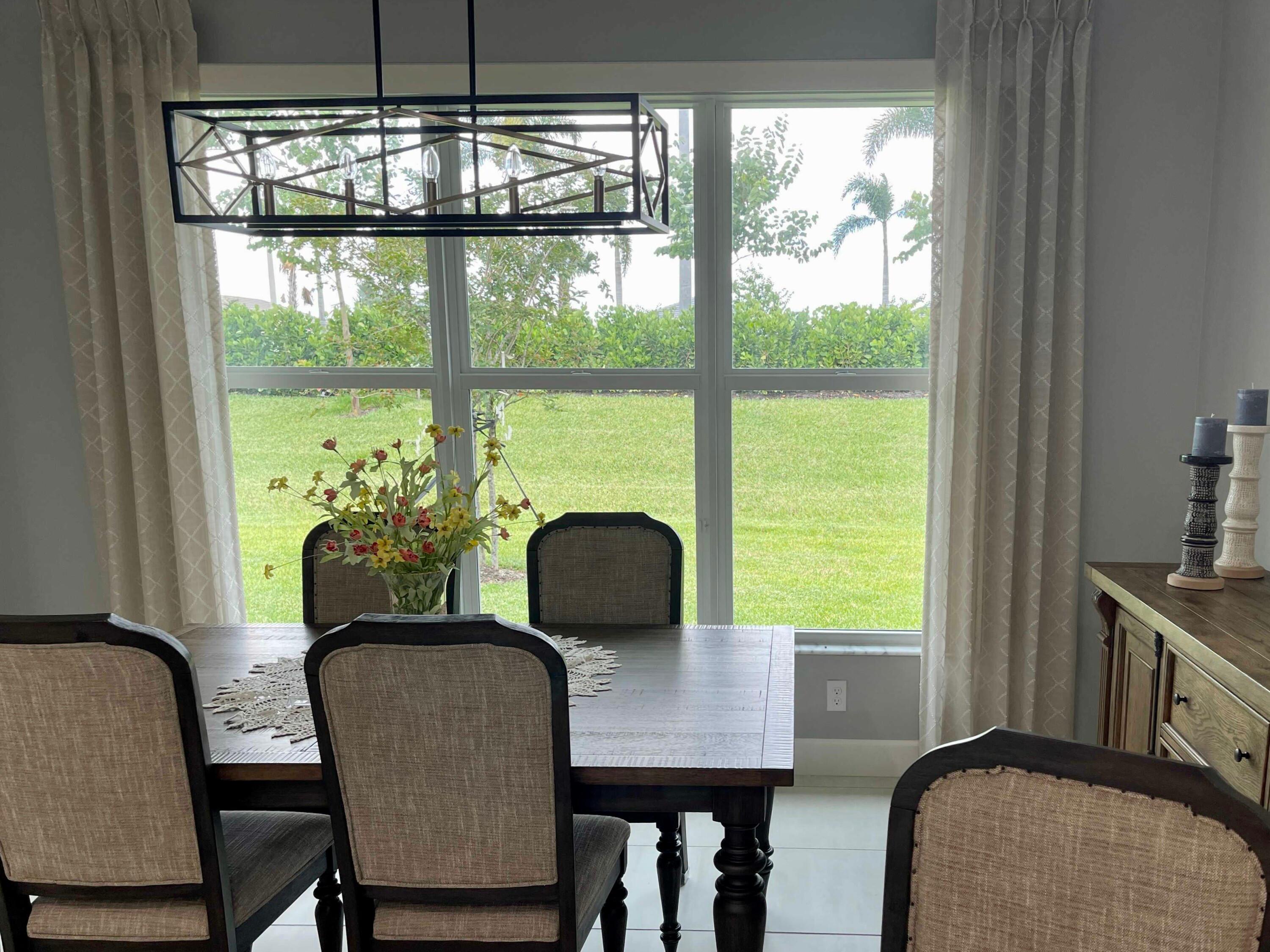 Drapery panels are a perfect way to dress up any window and they provide several useful properties at the same time. These patterned drapes in this Sebastian home work to block heat in the summer and hold in warmth in the winter, all while looking beautiful!