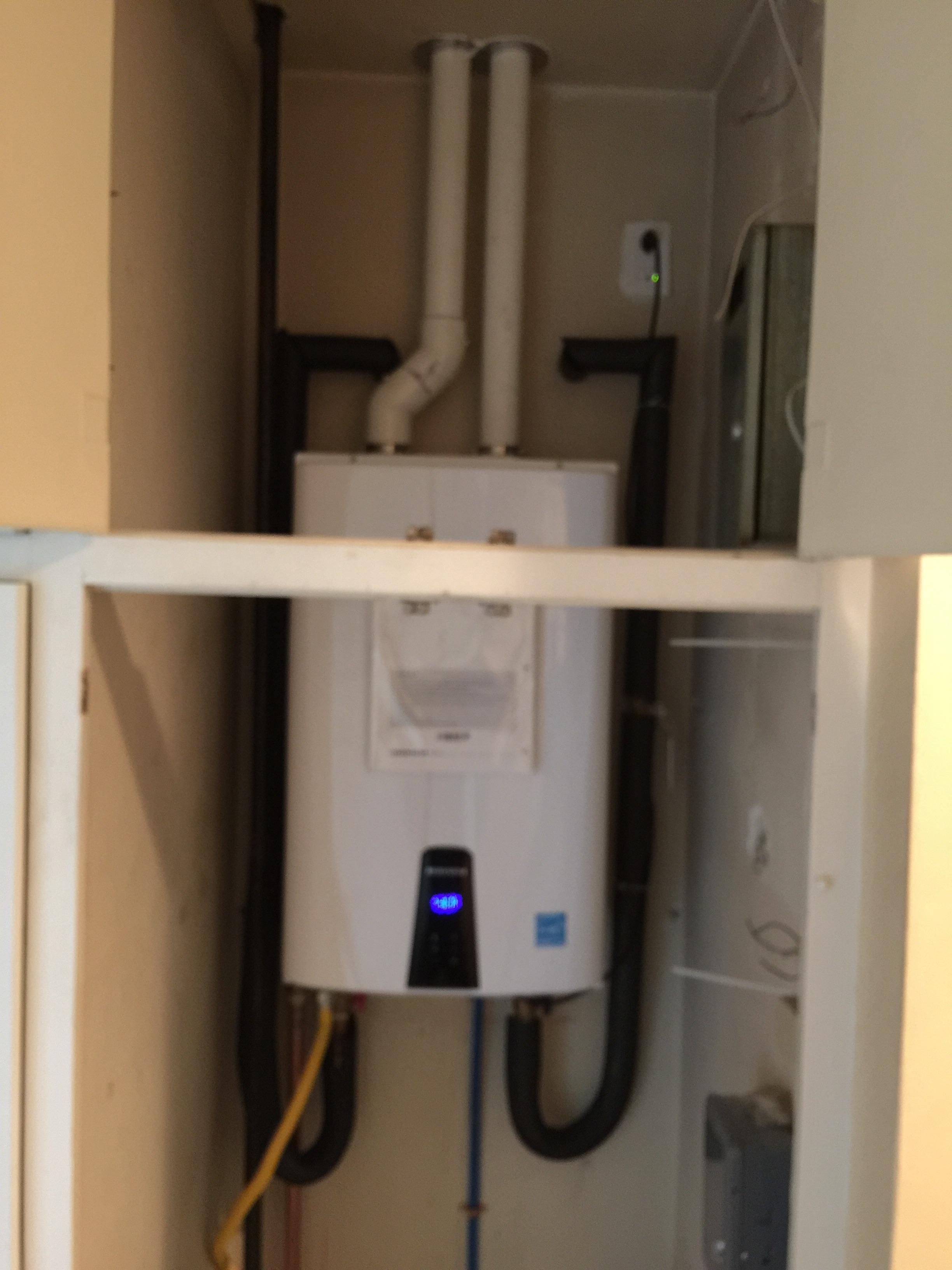 install tankless water heater inside house