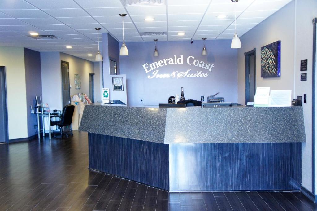 Emerald Coast Inn &amp; Suites Logo