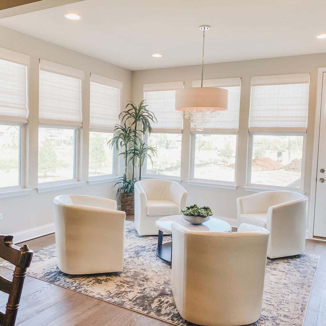 Custom shades blend seamlessly with your home decor, allowing soft light to enter and providing a radiant ambiance. Reduce brightness while retaining a warm glow in any room. Schedule a consultation today. (photo by Budget Blinds Naperville)