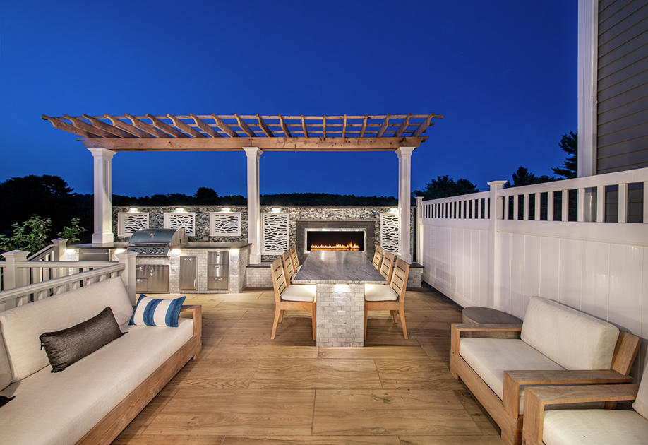 Outdoor living with built-in fireplace and grill