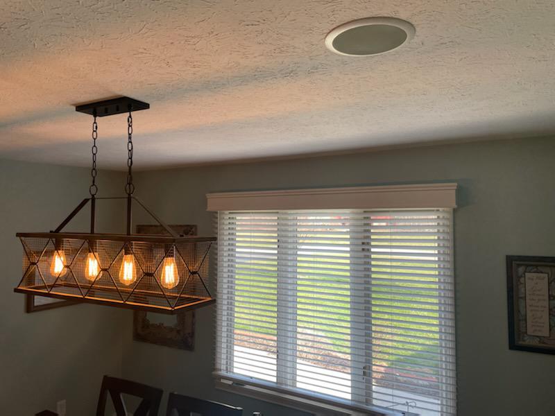 You can't go wrong with the classics! That's the idea in this Monrovia home! That's why this picture window from the dining room features our Wood Blinds.