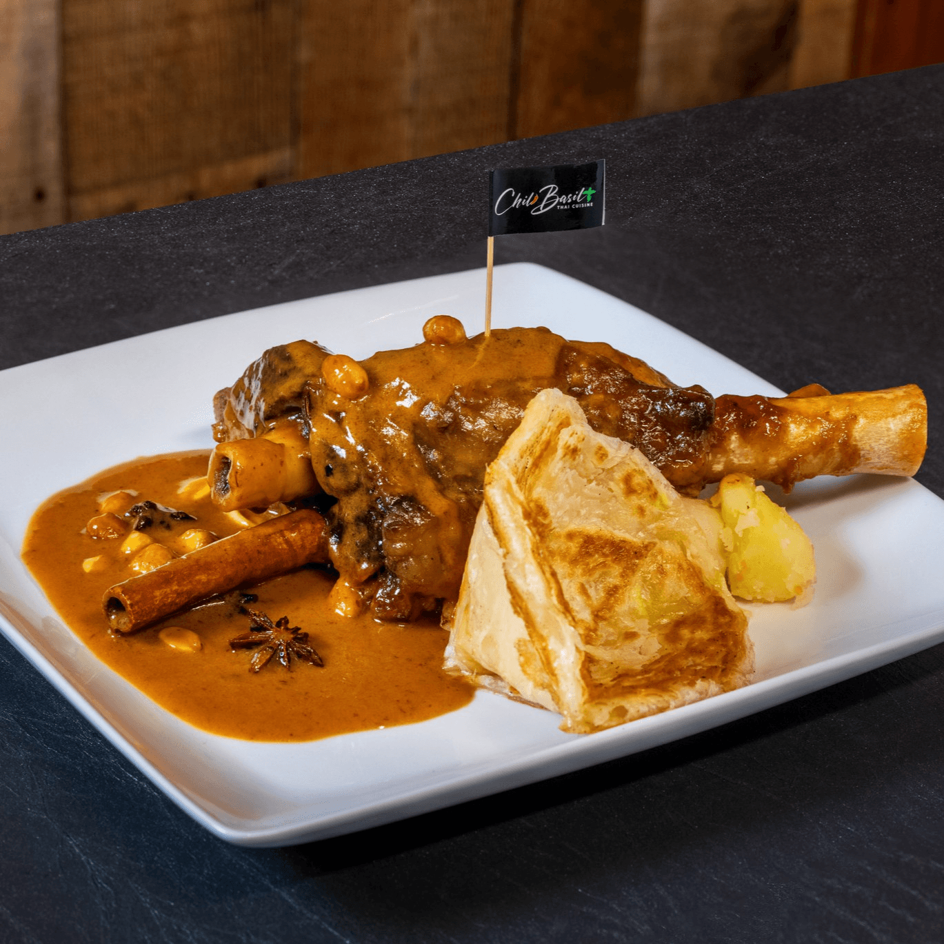 Lamb shank massaman with roti