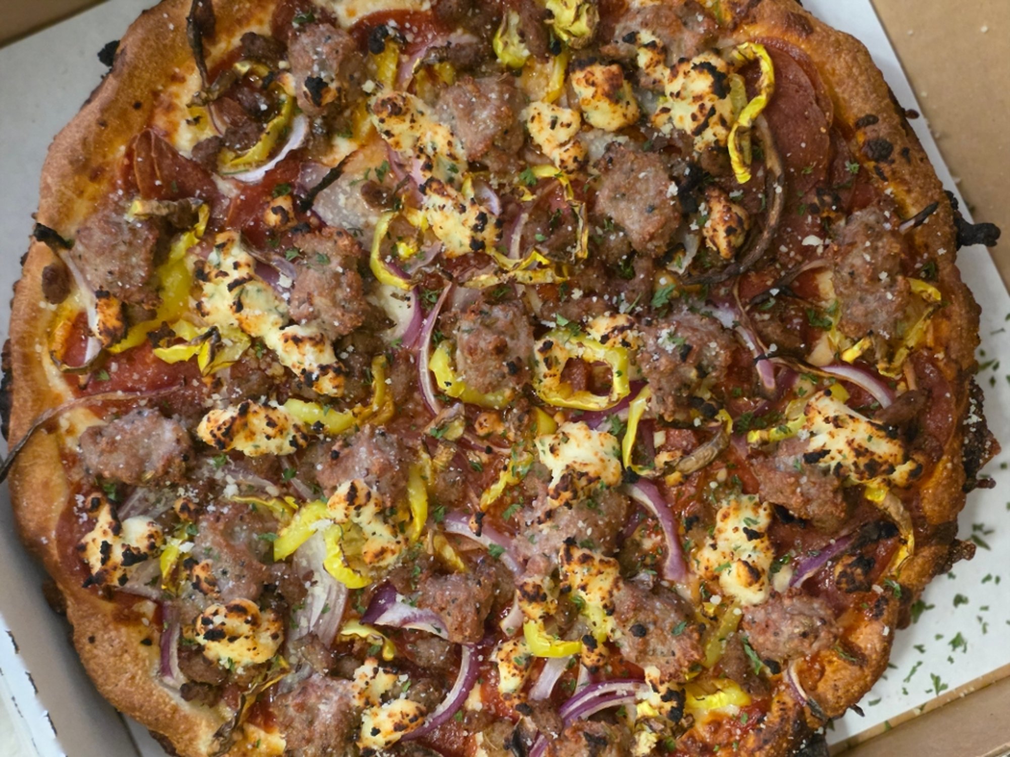 Cleveland pizza sauce, mozzarella, pepperoni, sausage, crumbled pork, red onion, banana pepper, r...