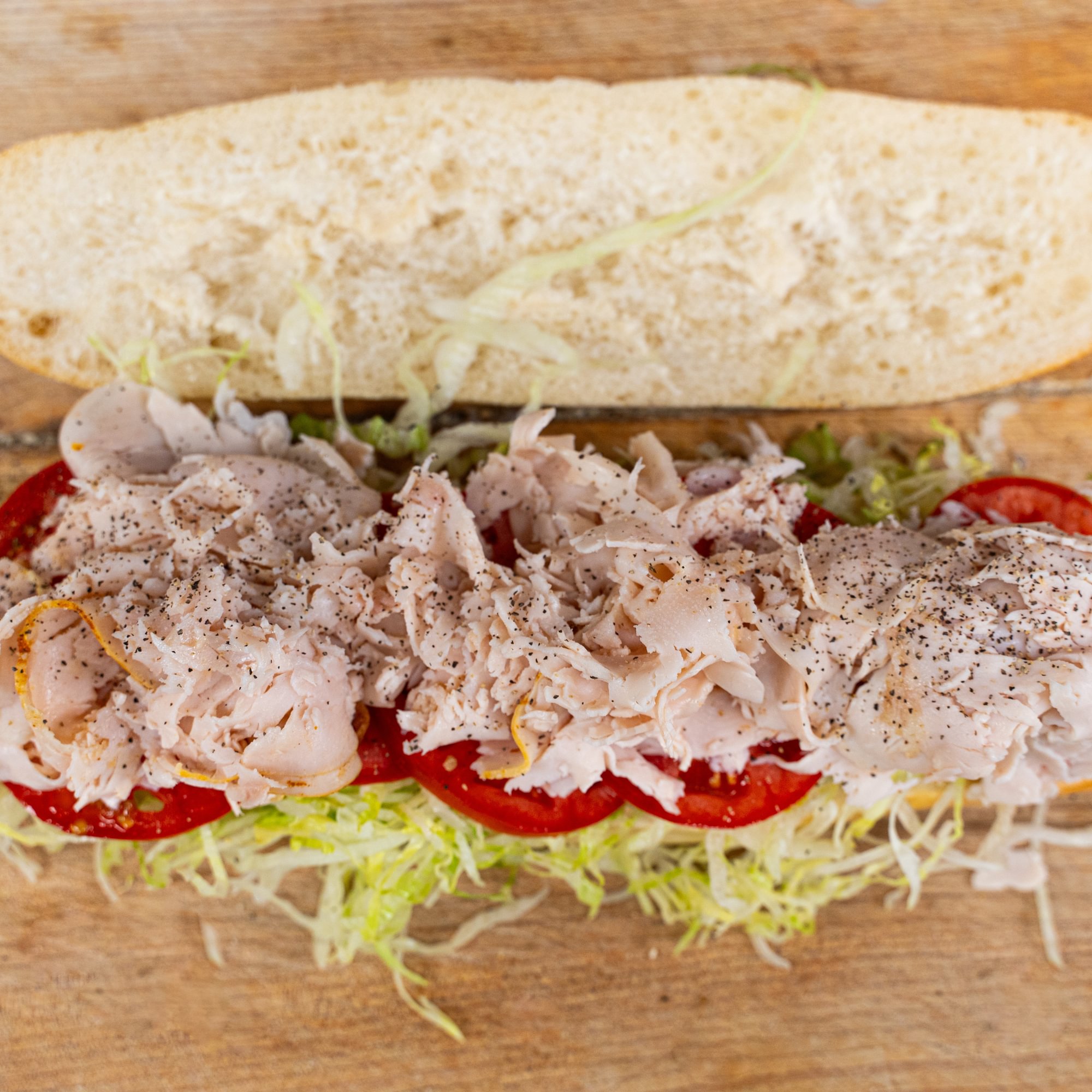 Turkey Club on a Hero with Mayo
