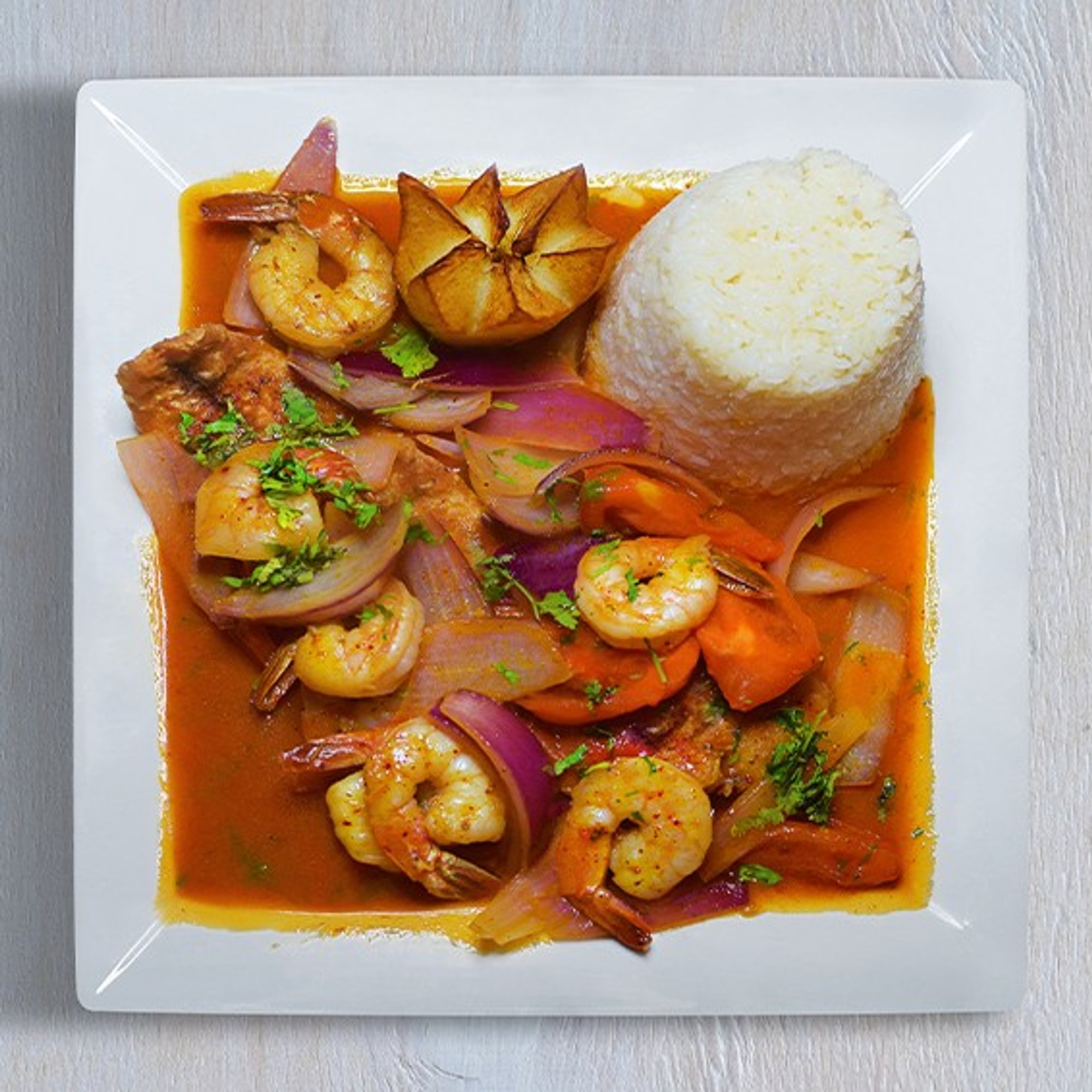 Corvina a la Chorrillana Con Camarones