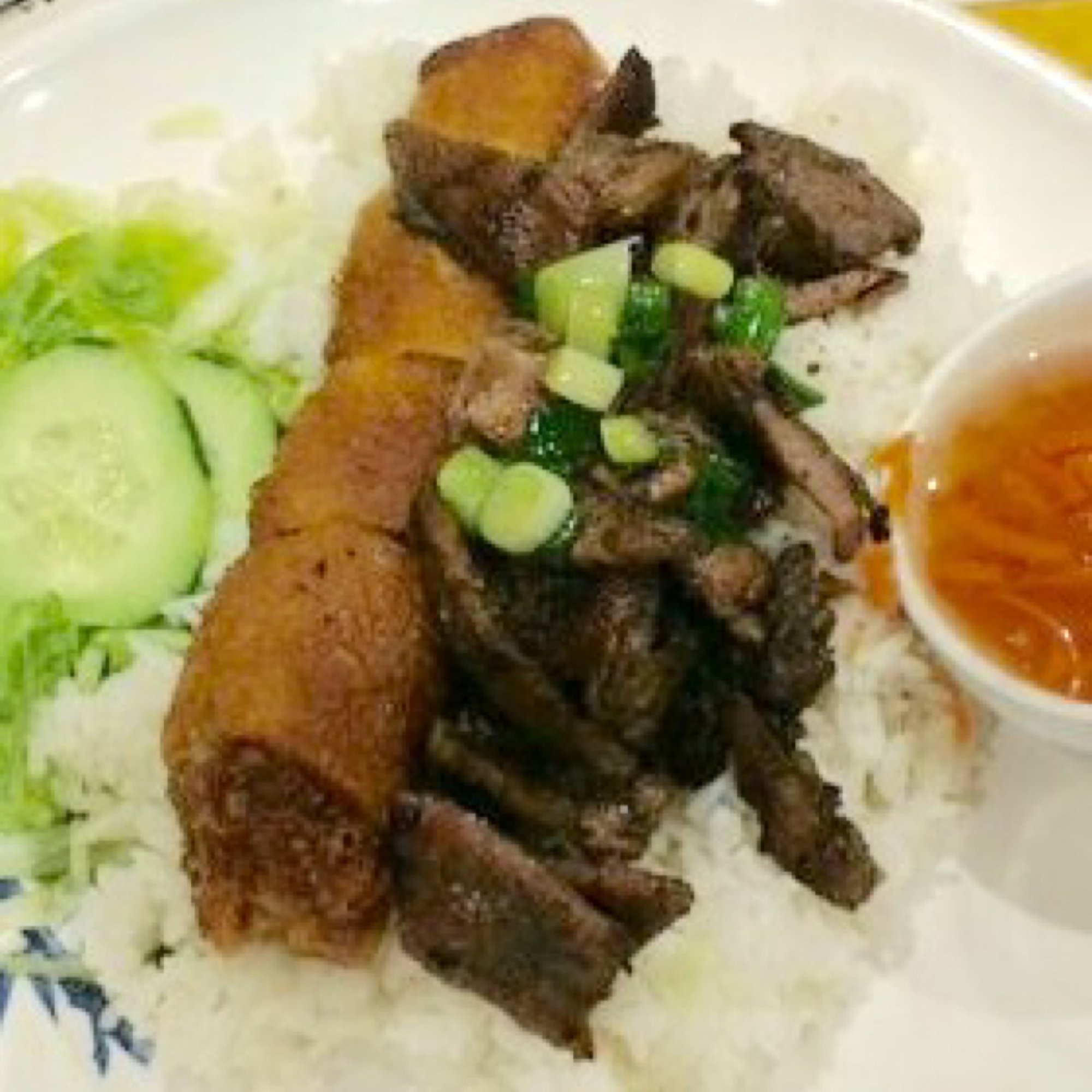 24. Imperial rolls with pork kebab over rice - cơm chả giò thịt nướng