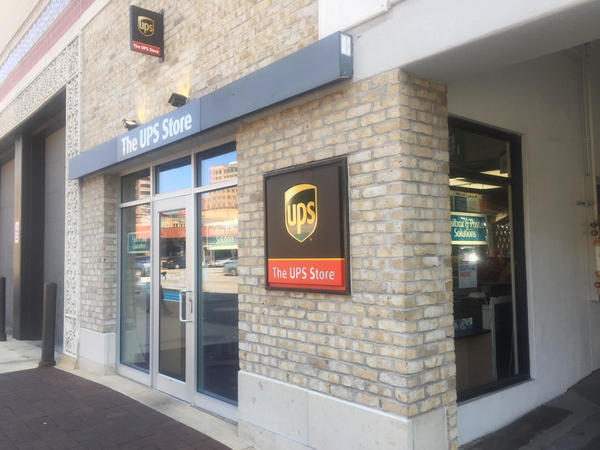 Front of the store enetering the parking garage on the side