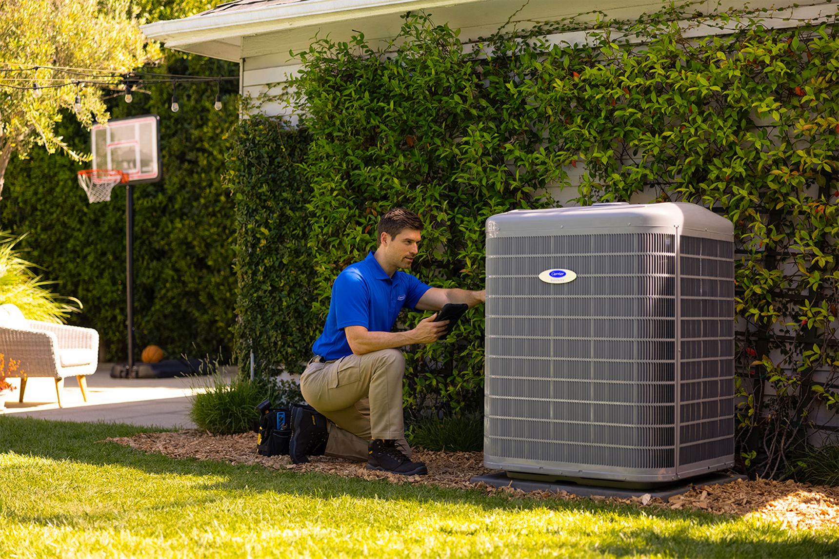 A Carrier dealer performs a heat pump repair.
