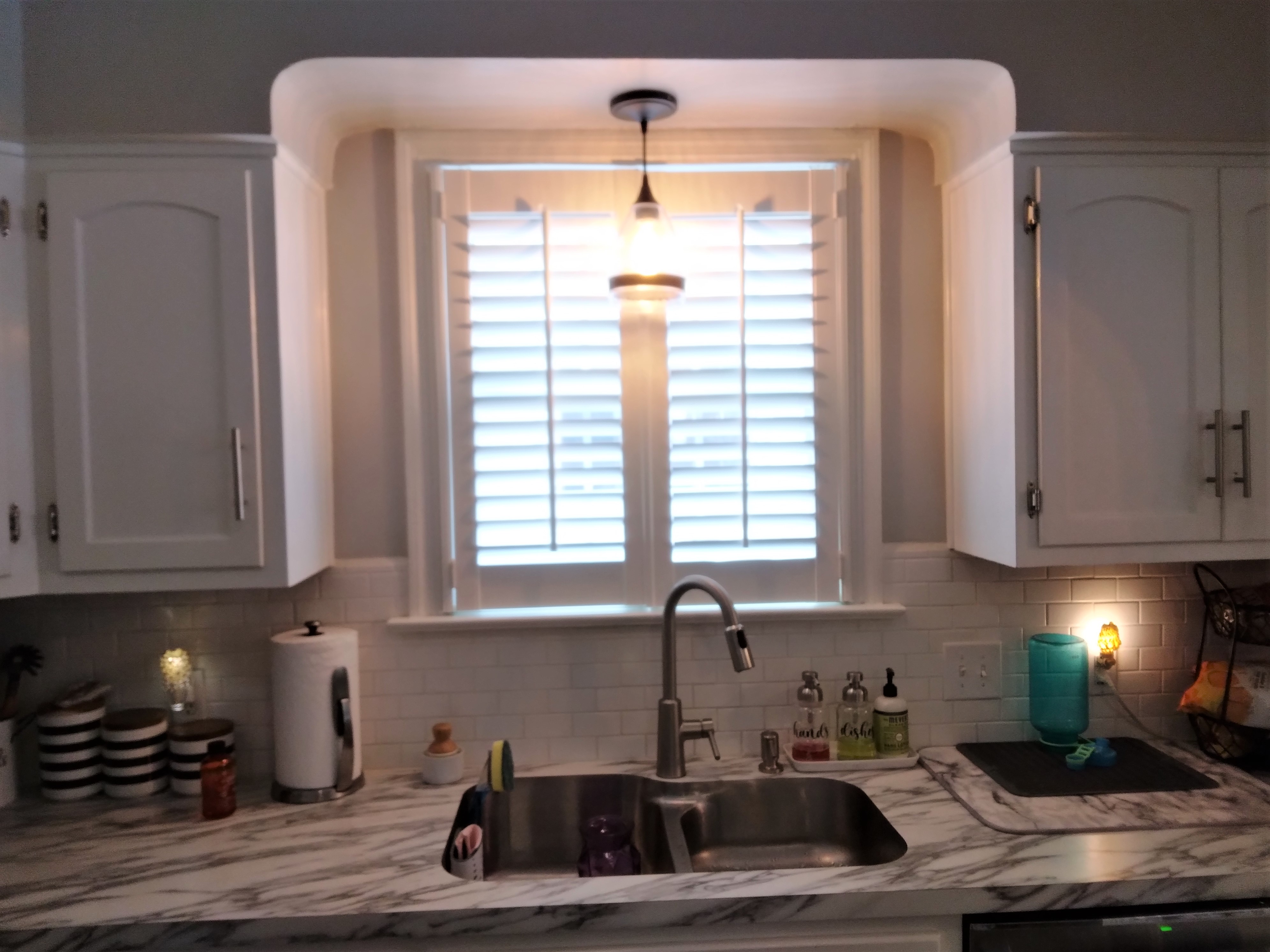 This white shutter compliments this kitchen with a classic and elegant look.  BudgetBlinds  WindowCoverings  Shutters  PlantationShutters  SpringfieldIllinois
