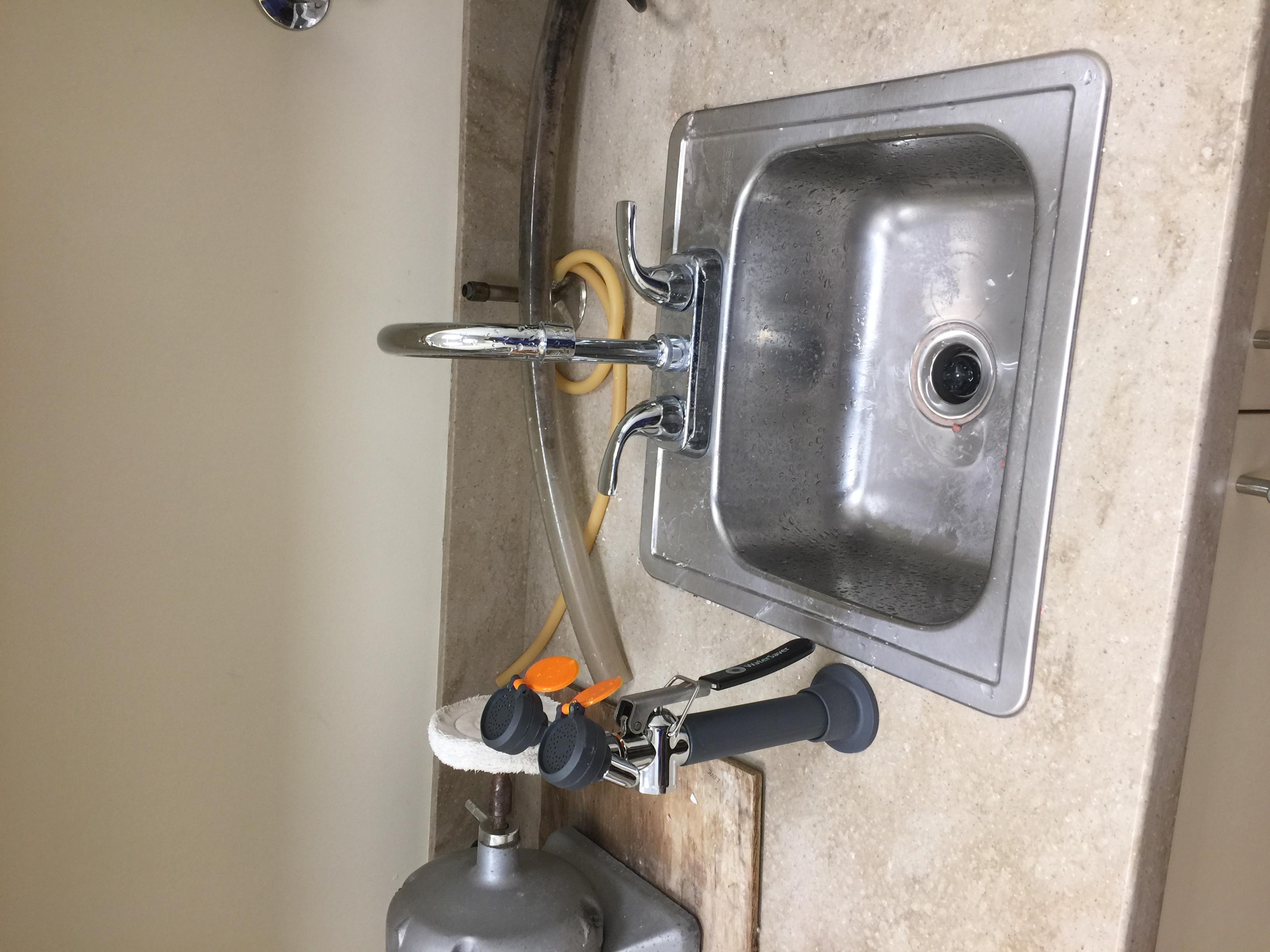 Install eye wash fixture for a dentist office