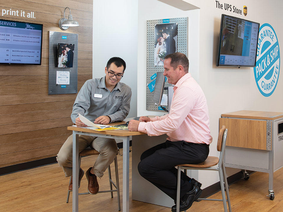 Customer sitting during print consultation at The UPS Store