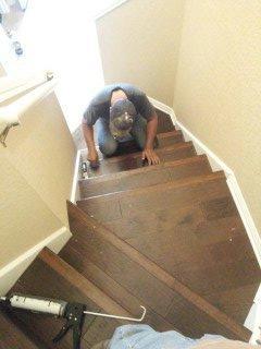 My son Bryan installing custom flooring for stairs.