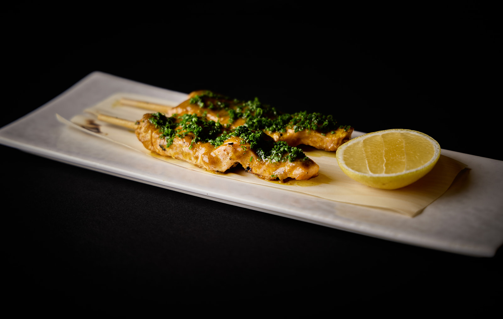 Silken salmon with a subtle, citrusy  anticucho of ají amarillo