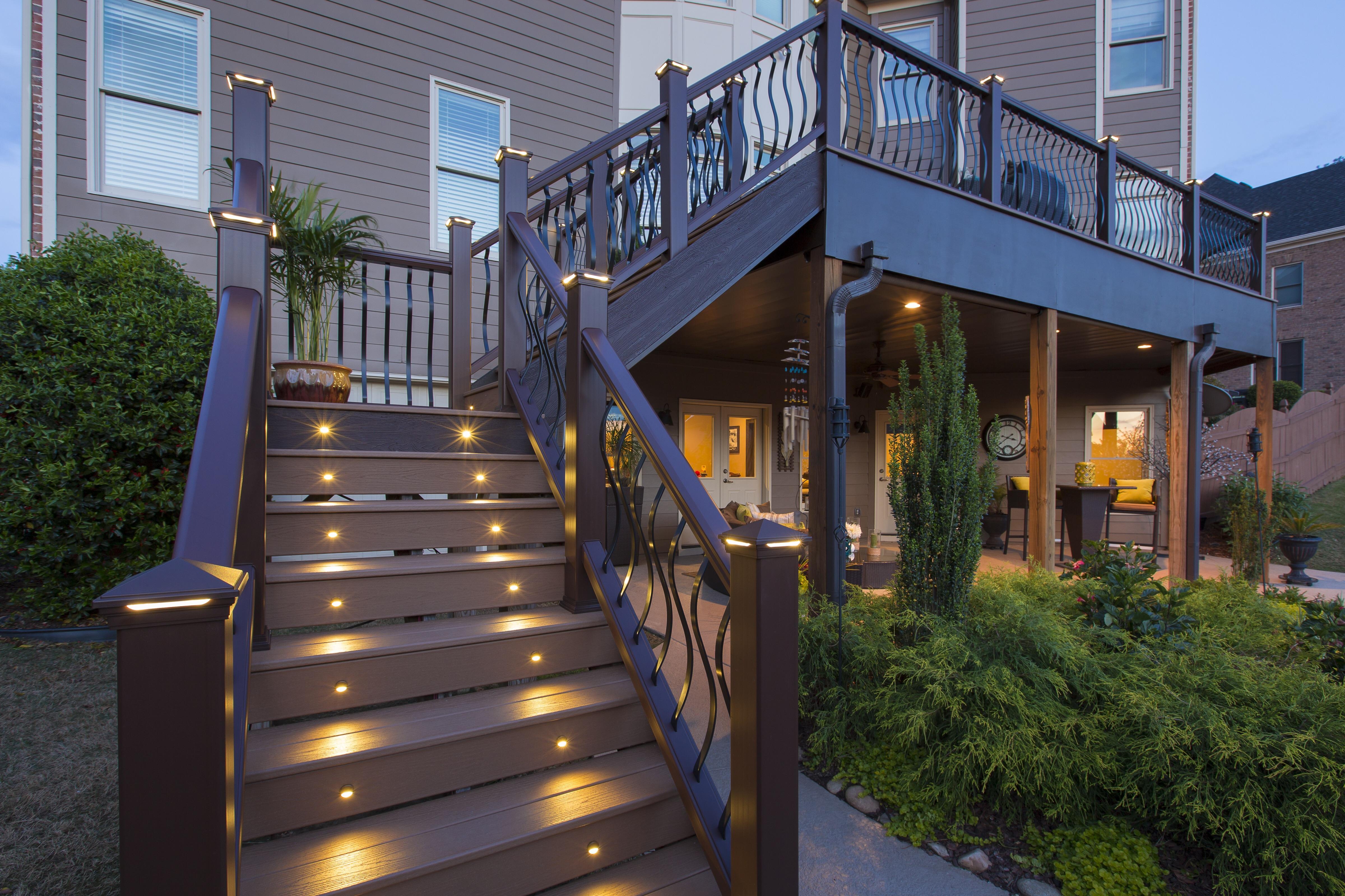 This picture depicts a true Trex Premium Deck. This deck features Lighting, Transcend Decking and Railing, Drainage System, and Upgraded Balusters