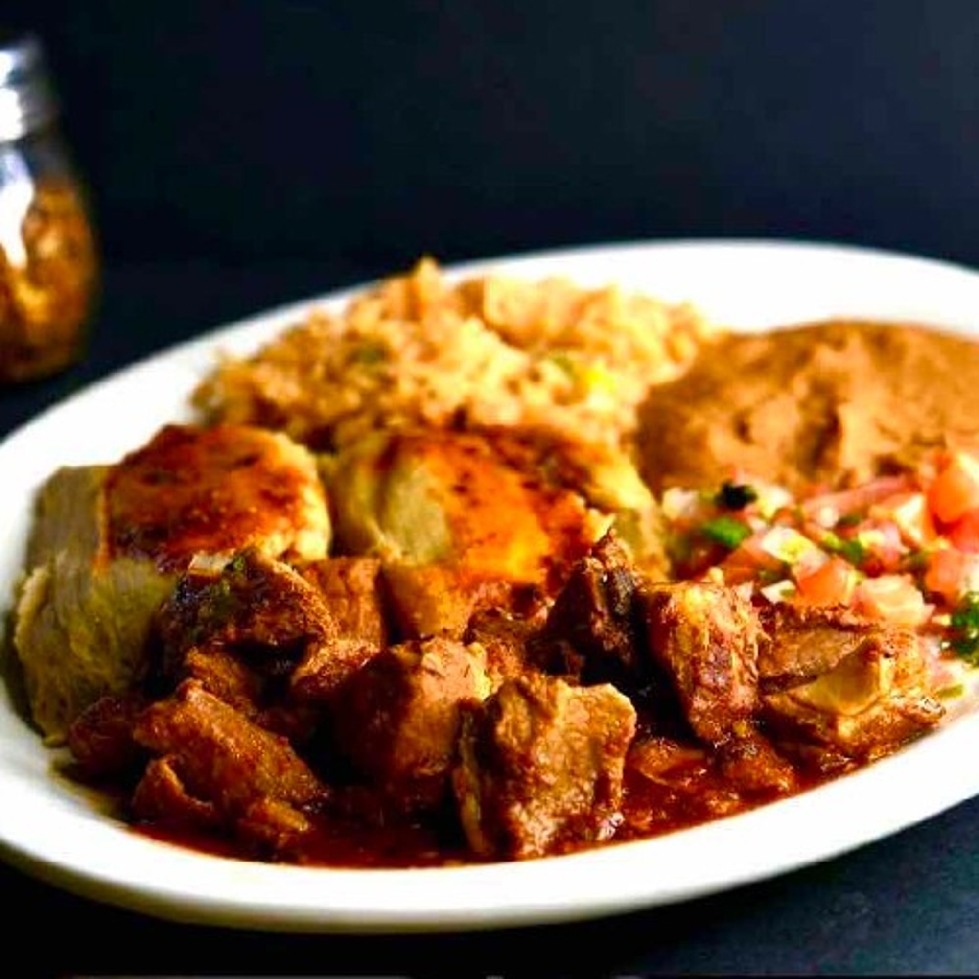 37. 2 Tamales, Asado, Spanish Rice, Refried Beans and Pico De Gallo