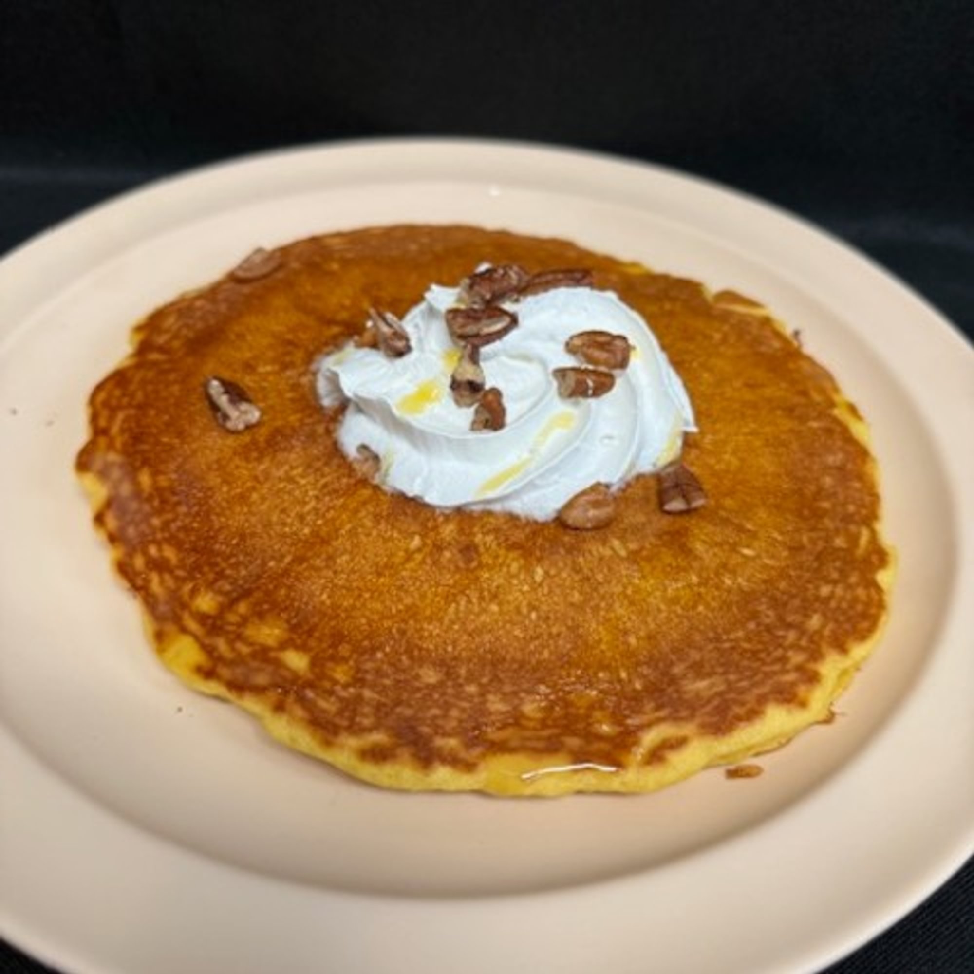 Two Pecan Hot Cakes with Whipped Cream