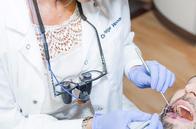 Holistic Dentist, Dr. Paige Woods Examining Patient Holistic Dentist, Dr. Paige Woods Examining Patient