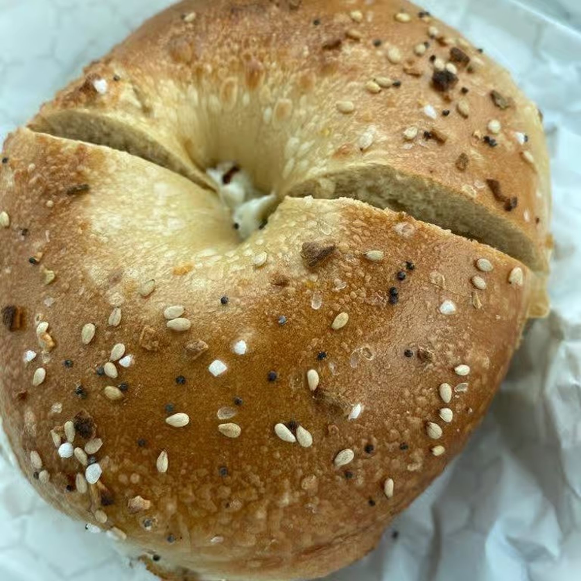A bagel with scallion spread