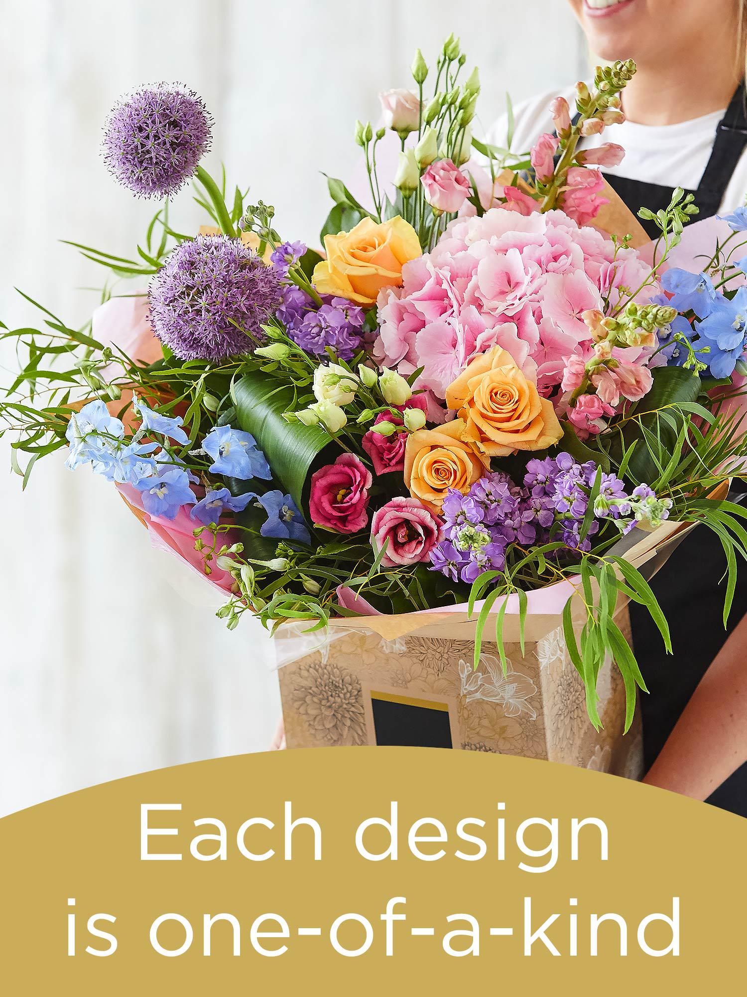 Hand-tied bouquet made with seasonal flowers