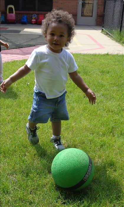 We loving seeing our toddlers enjoy large motor activities like kicking a ball.