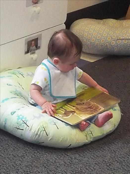 Early exposure to literacy starts in our Infant classroom