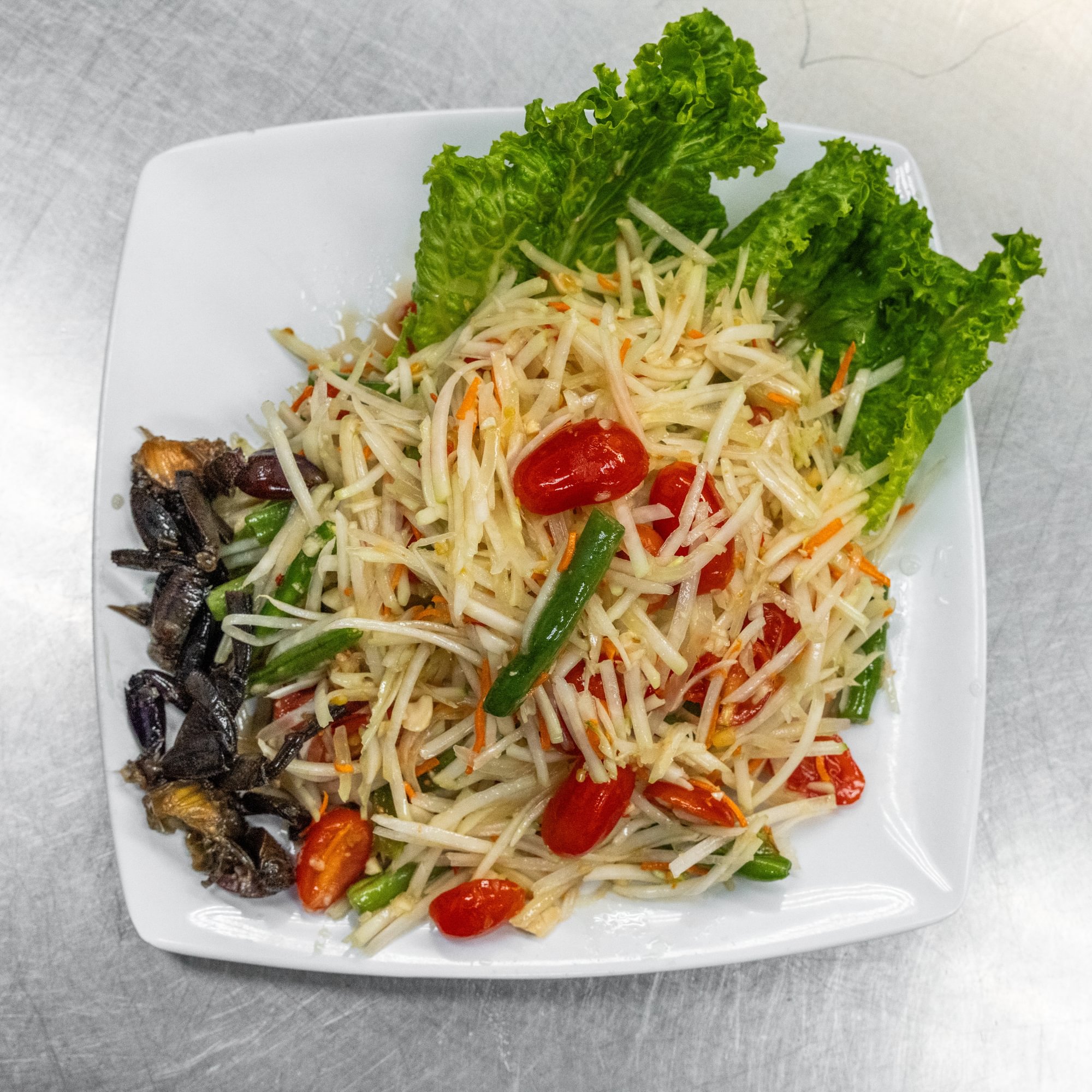 21. Som Tum Pu Pla La Salad