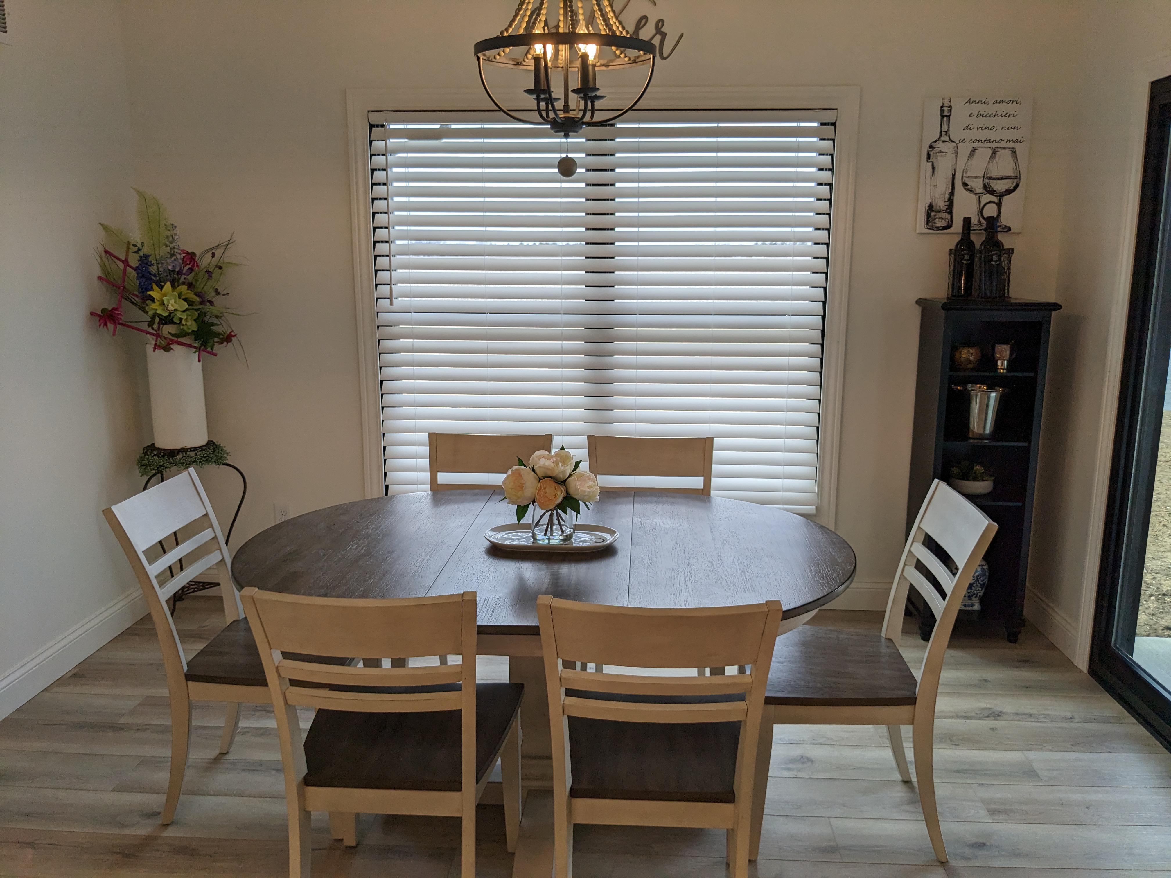 Cordless white faux wood blinds in Springfield Illinois dining room.  BudgetBlinds  WindowCoverings  Blinds  SpringfieldIllinois