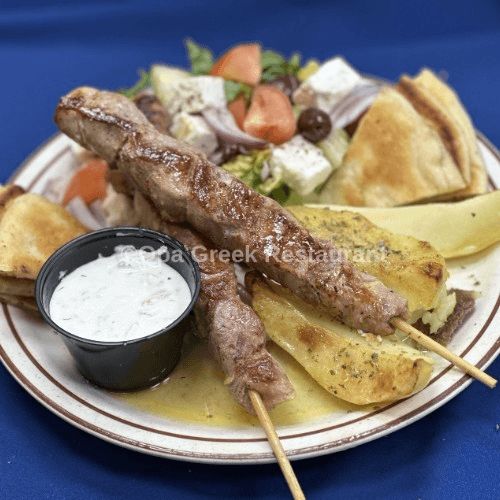 Pork Souvlaki (2 skewers) Platter Greek Salad, Pita Bread, Tzatziki Sauce, Choice Of Lemon Potato...