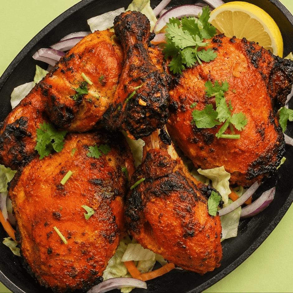 Bone in Tandoori Chicken, marinated and slow cooked in traditional clay oven. Served with rice.